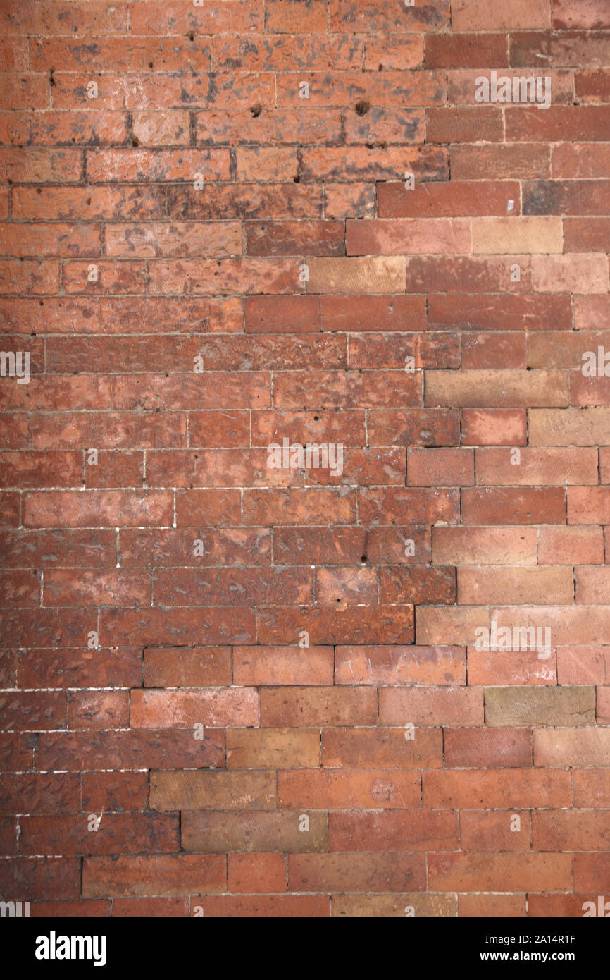 Old wall made of red brick, restored with modern building material Stock Photo Alamy