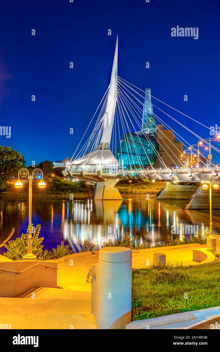 The city skyline from the St. Boniface Promenade at night in Winnipeg