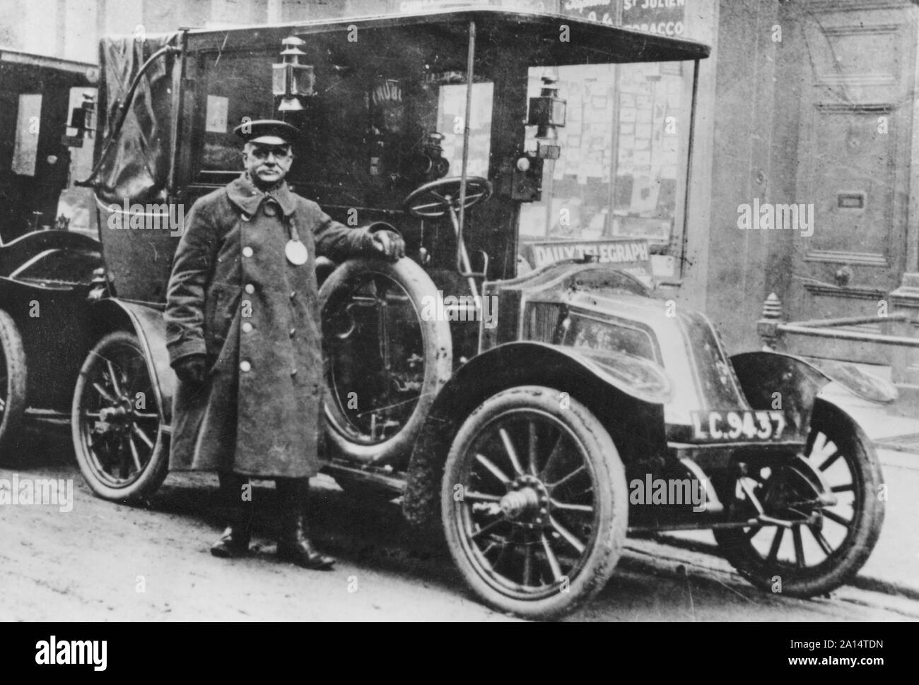 Car history. The french car manufacturer Renault and one of their cars as a taxi on a Paris street. On this picture from 1914, many taxi cars were used to transport troups to the Battle of Marne in september. Already 1905 were taxidrivers using taximeter in their cars that calculated the price depending on the time and distance. Stock Photo