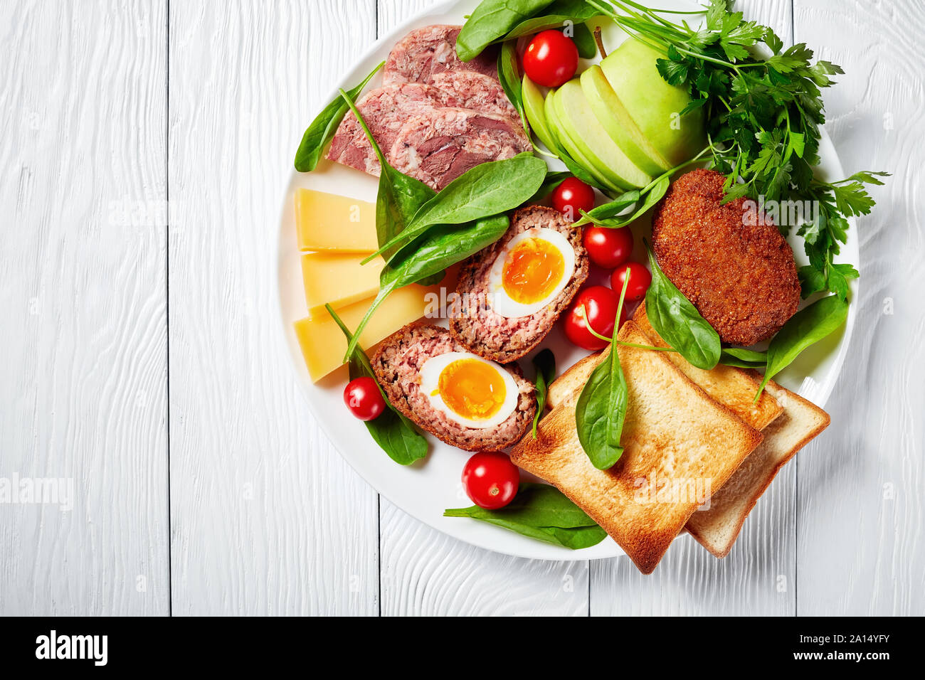 toasts, cheddar cheese, apple, scotch eggs, sliced head cheese