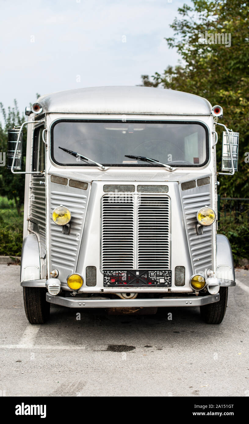 Old camper parked on asphalt road. Vintage travel concept Stock Photo ...
