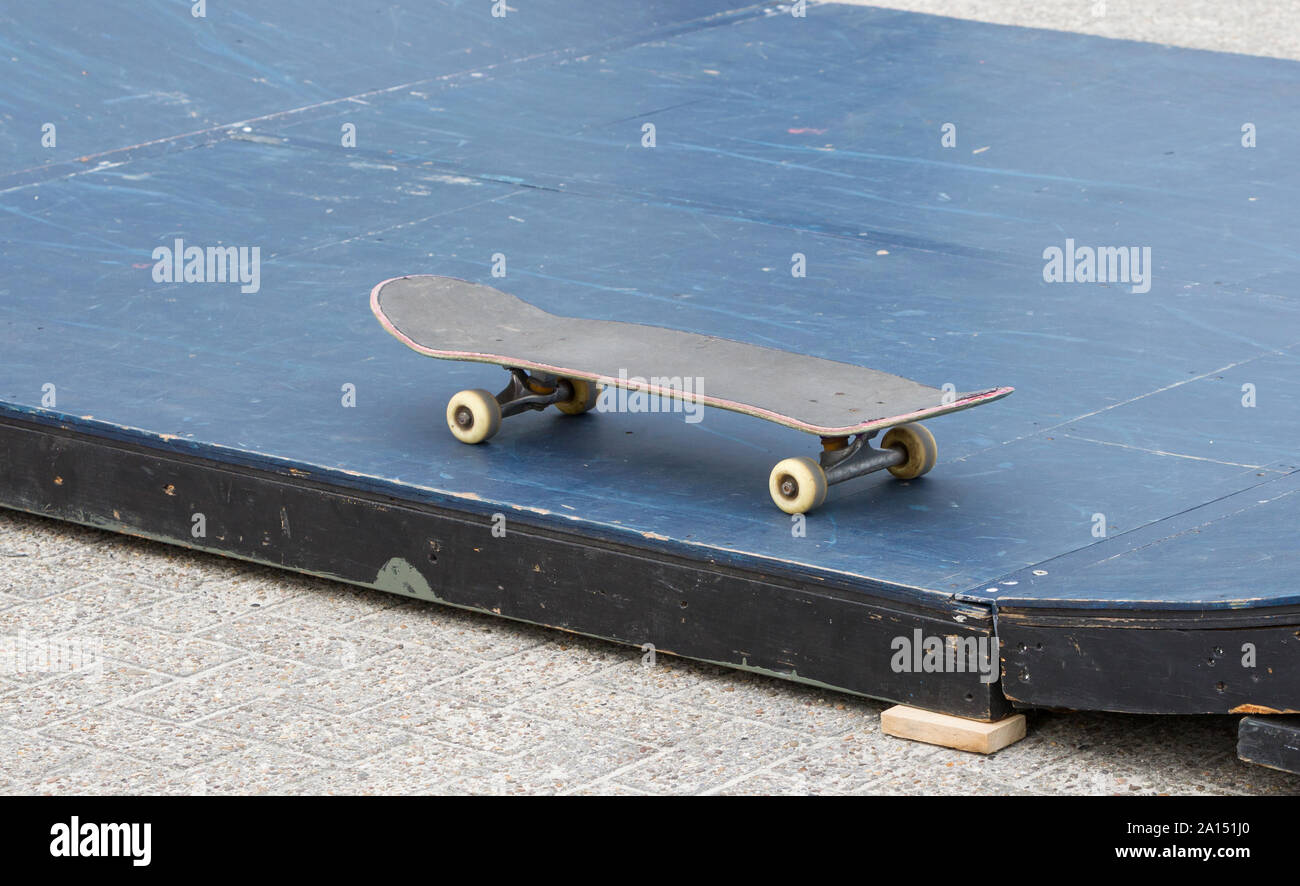 Skateboard isolated on a halfpipe, urban sports Stock Photo Alamy