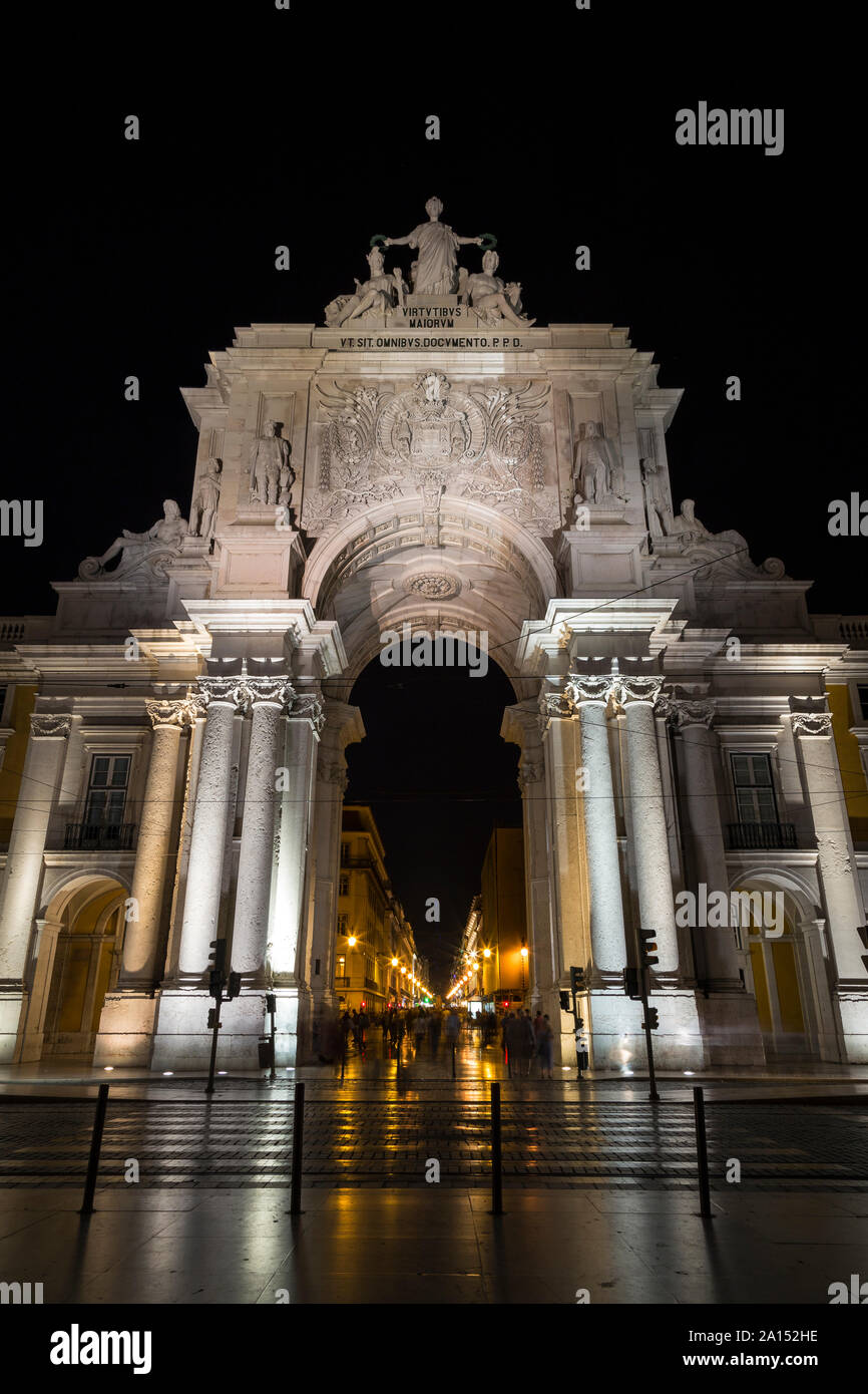 The 18th century Arco da Rua Augusta, triumphal arch gateway, next to the Praca do Comercio square in Baixa district, Lisbon, Portugal, in the evening Stock Photo