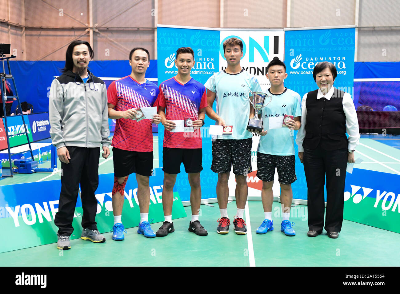 Alvin Morada and Peter Gabriel Magnaye (Philippines) seen during the Men's Single medal awarding ceremony of the 2019 Sydney International, Morada and Magnaye won silver medal by losing the finals to Chen Xin-Yuan and Lin Yu Chieh (Chinese Taipei) 21-9, 11-21, 15-21.  From left to right: Yonex Australia area manager Michael Fariman, Magnaye, Morada, Chen, Lin and Badminton NSW President Carolyn Toh. Stock Photo