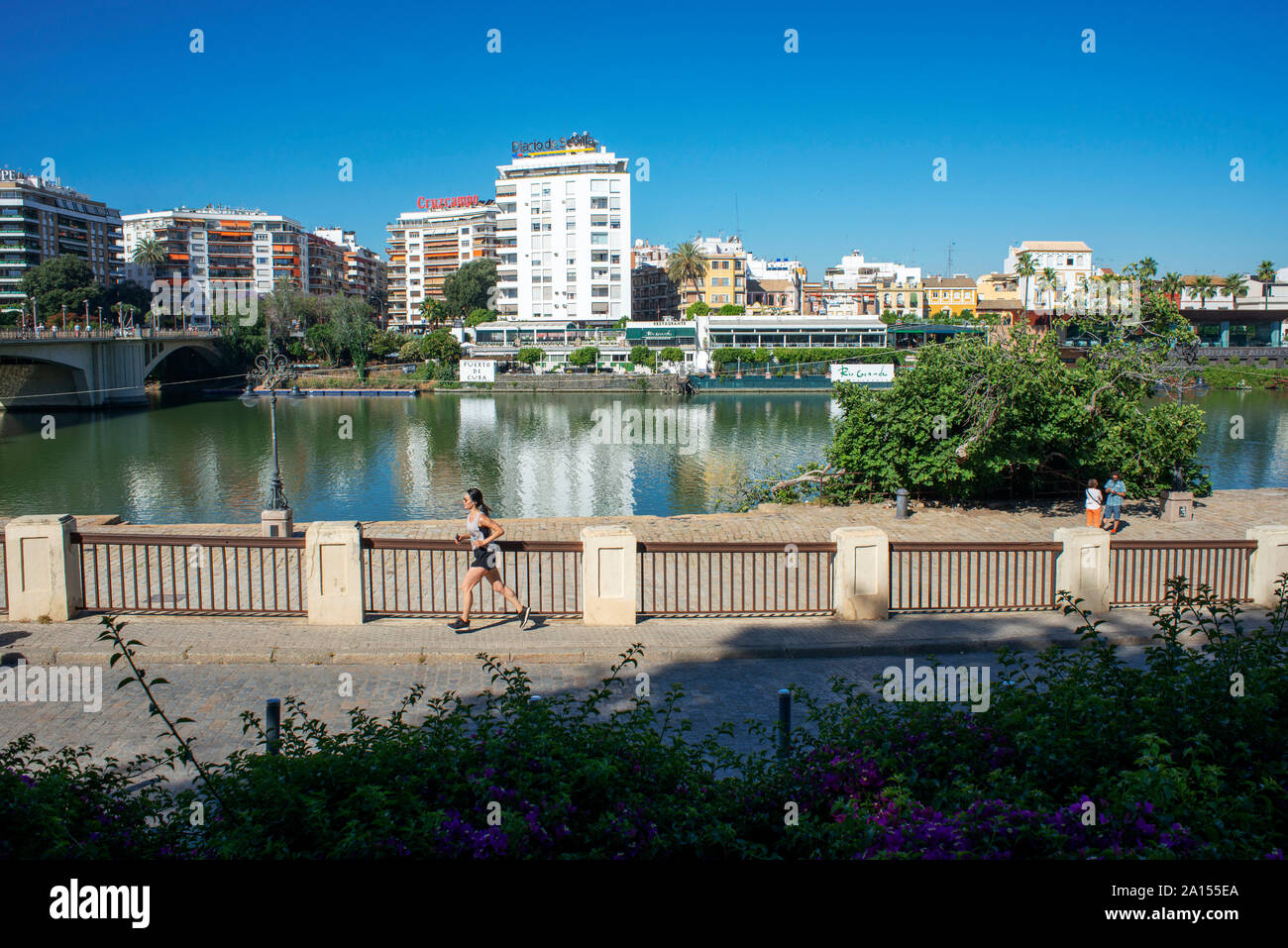 Andalucia river, view of houses and apartments in the Triana barrio quarter of Seville - Sevilla - alongside the Rio Guadalquivir in Andalucia, Spain. Stock Photo