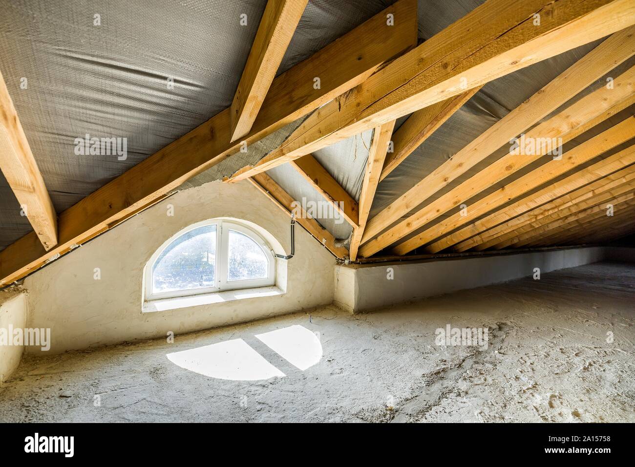 Attic Of A Building With Wooden Beams Of A Roof Structure And A