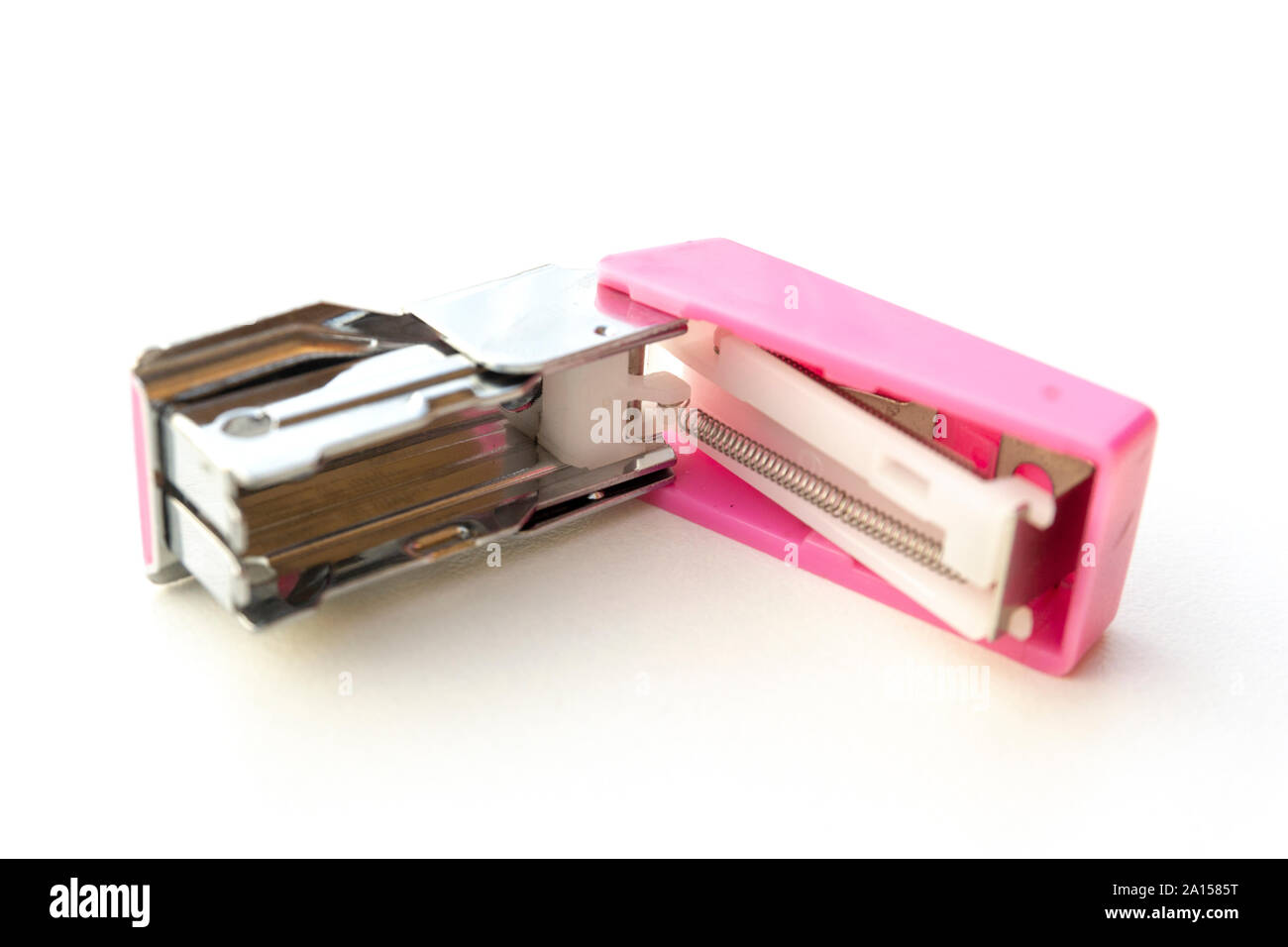 Small pink stapler isolated on white background. Stock Photo