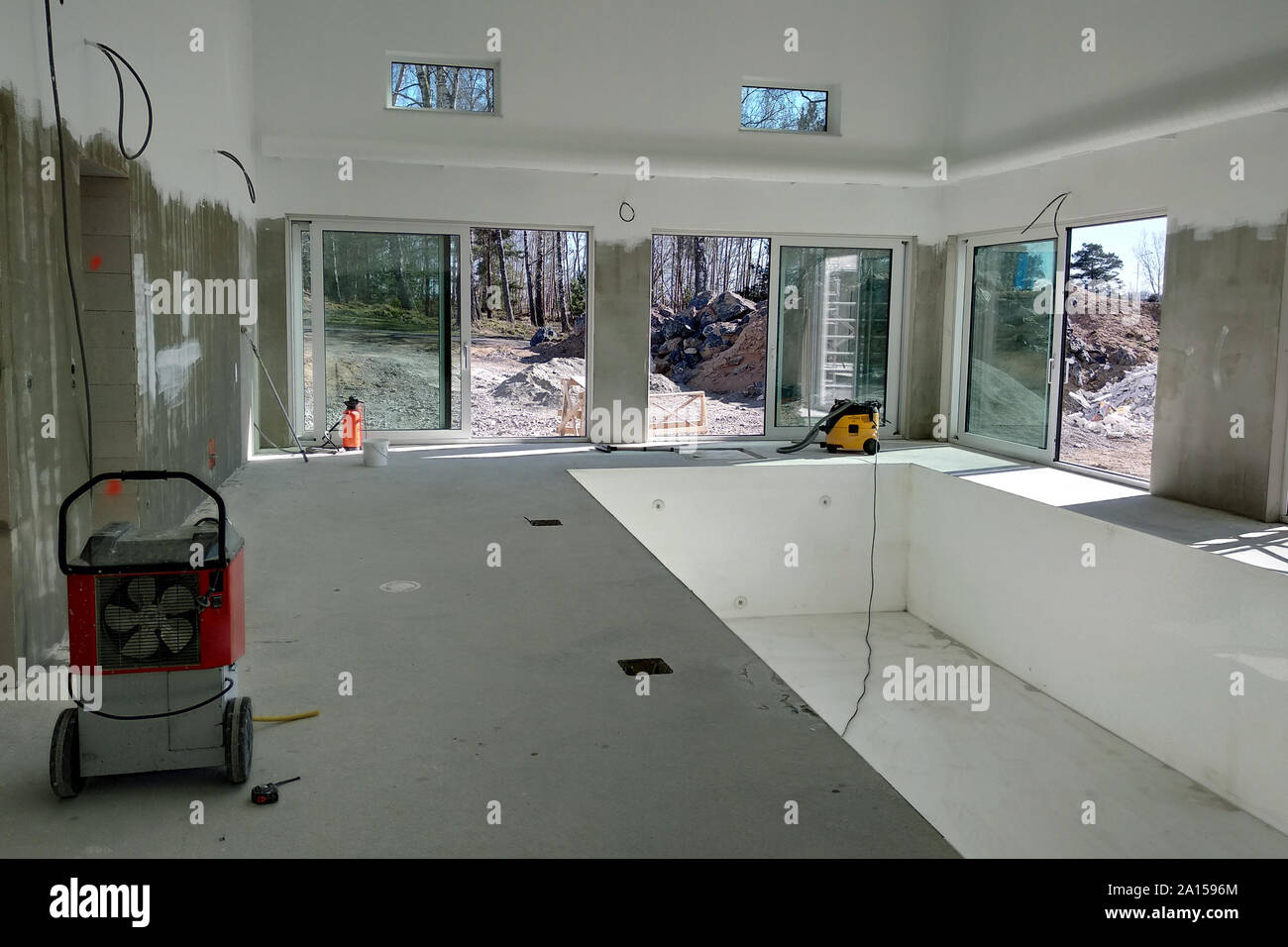 Interior of a house with big swimming pool under renovation works Stock ...