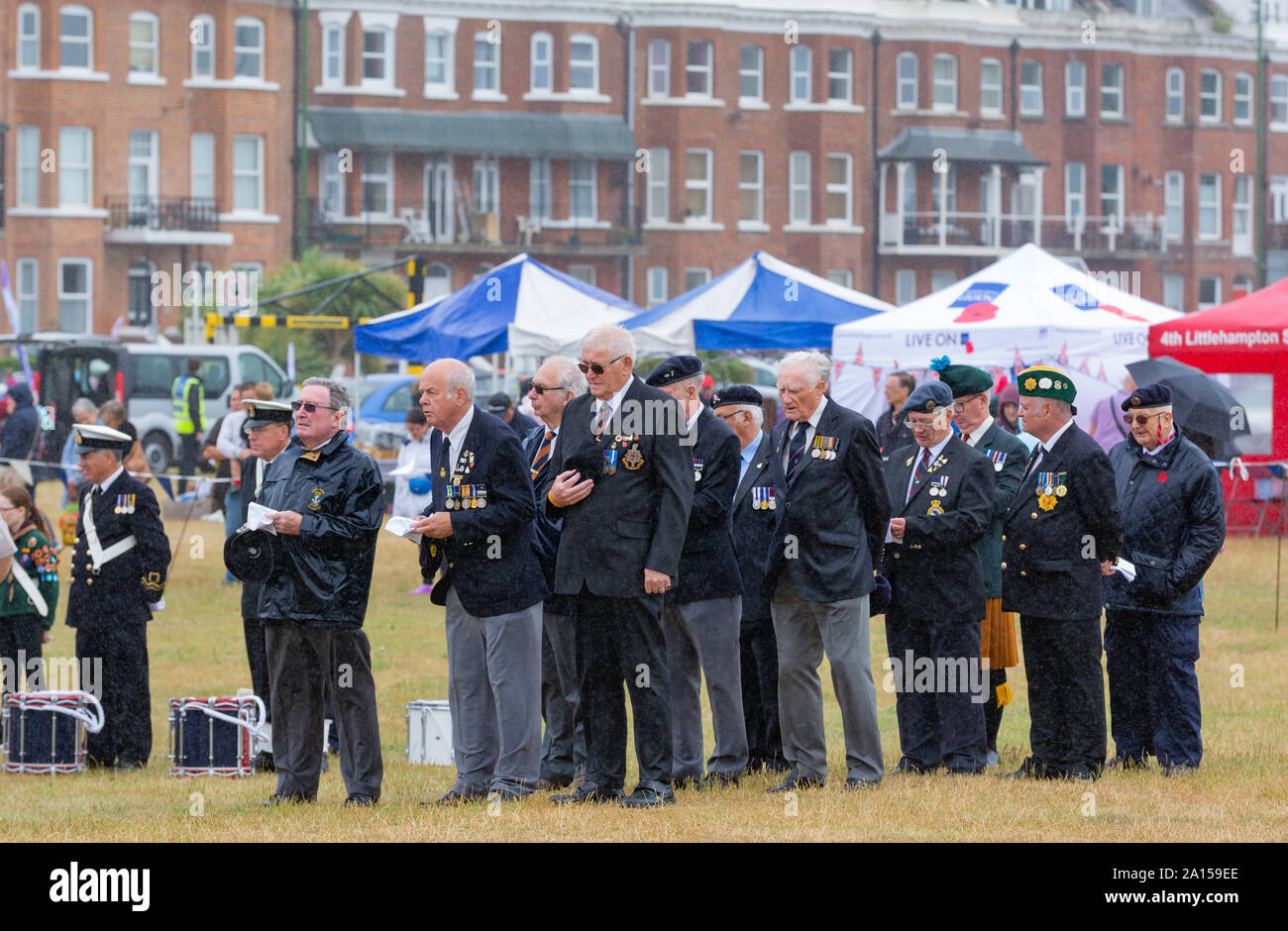 Veteran military men standing in the rain at the morning service at the June 2017 Armed Forces Day event in Littlehampton, West Sussex, UK. Stock Photo
