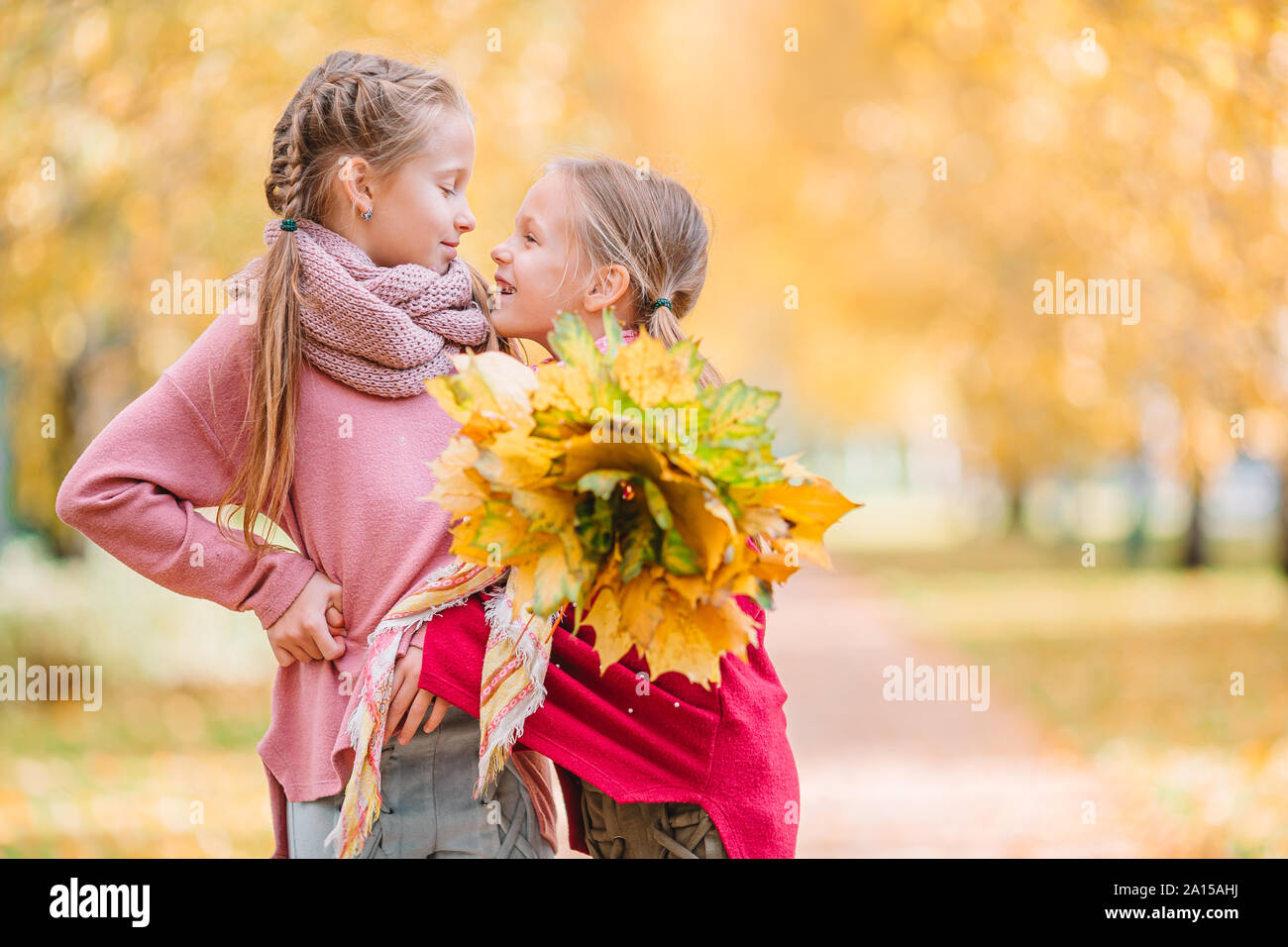 Kids in the park at warm sunny autumn day Stock Photo - Alamy