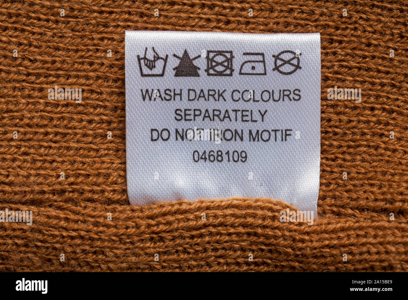 wash dark colours separately do not iron motif label in clothing - Care washing symbols and instructions Stock Photo