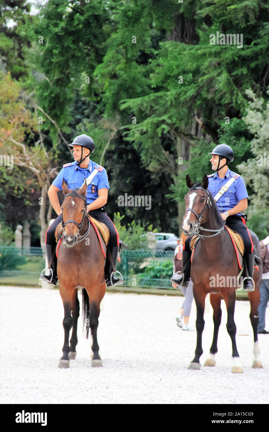 Rome, Italy - October 4, 2013: Two Carabinieri, Italian horse police on patrol in the city park Stock Photo