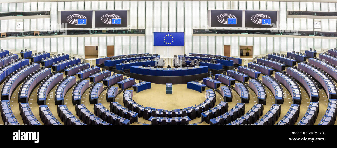 Panoramic view of the hemicycle of the European Parliament in Brussels, Belgium, with the flag of the European Union above the desk of the president. Stock Photo