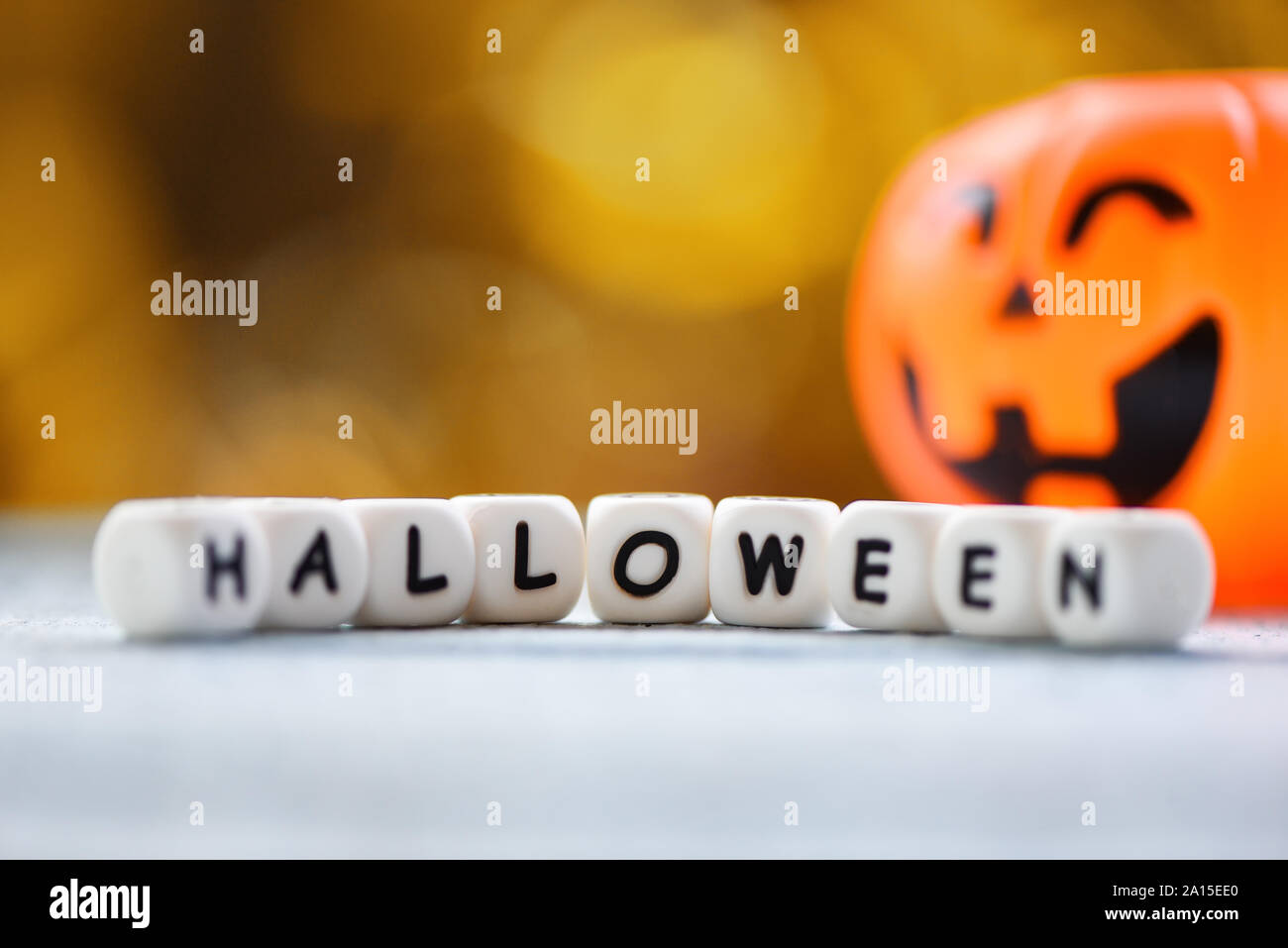 Halloween background decorated holidays festive concept / funny faces jack o lantern pumpkin halloween decorations for party accessories object  on wo Stock Photo