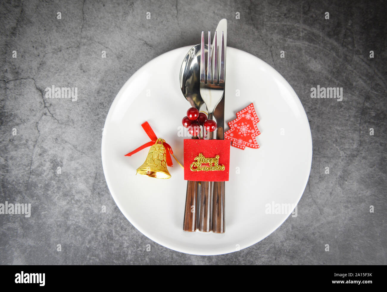 Christmas table place setting decoration with fork spoon and knife on white  plate Xmas New Year food lunch festive Christmas dinner holidays backgroun  Stock Photo - Alamy