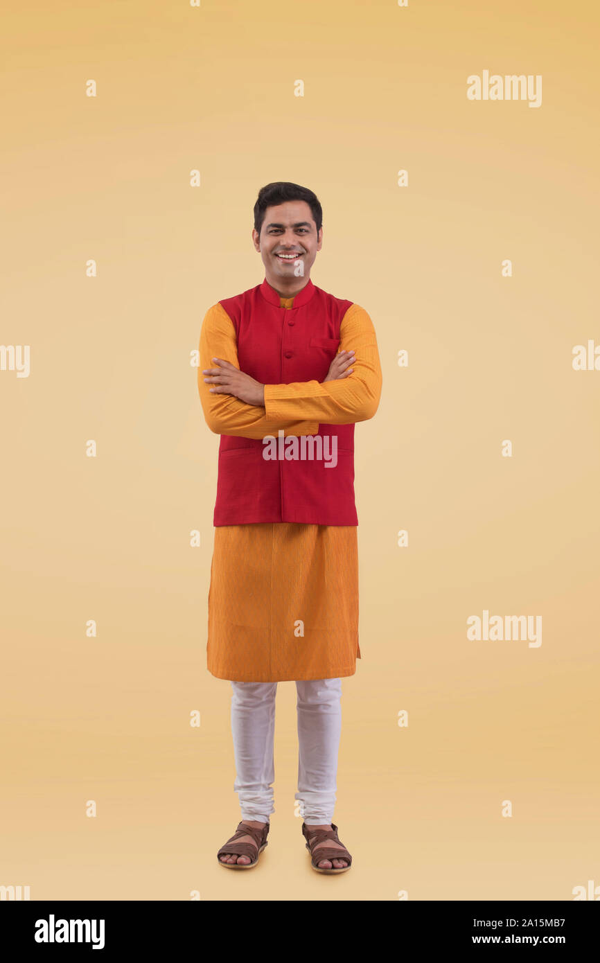 Portrait of a young Man standing Arms Crossed Stock Photo - Alamy