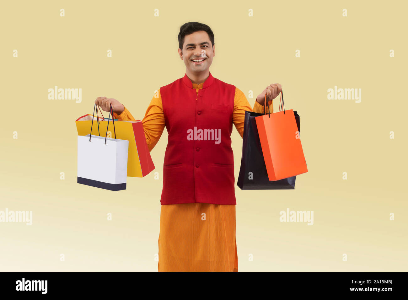 Portrait of a Man holding shopping bags Stock Photo - Alamy