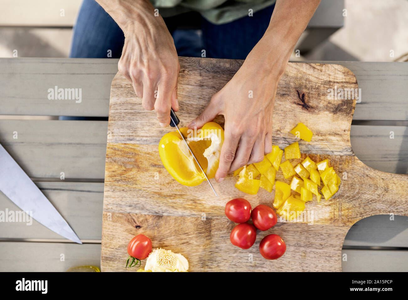 Close-up of woman preparing healthy food outdoors Stock Photo