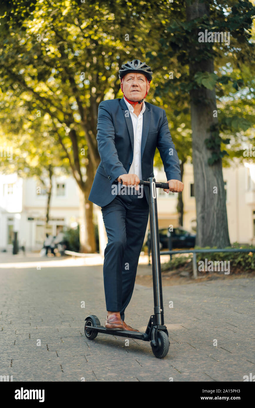 Man riding on an e scooter hi-res stock photography and images - Alamy