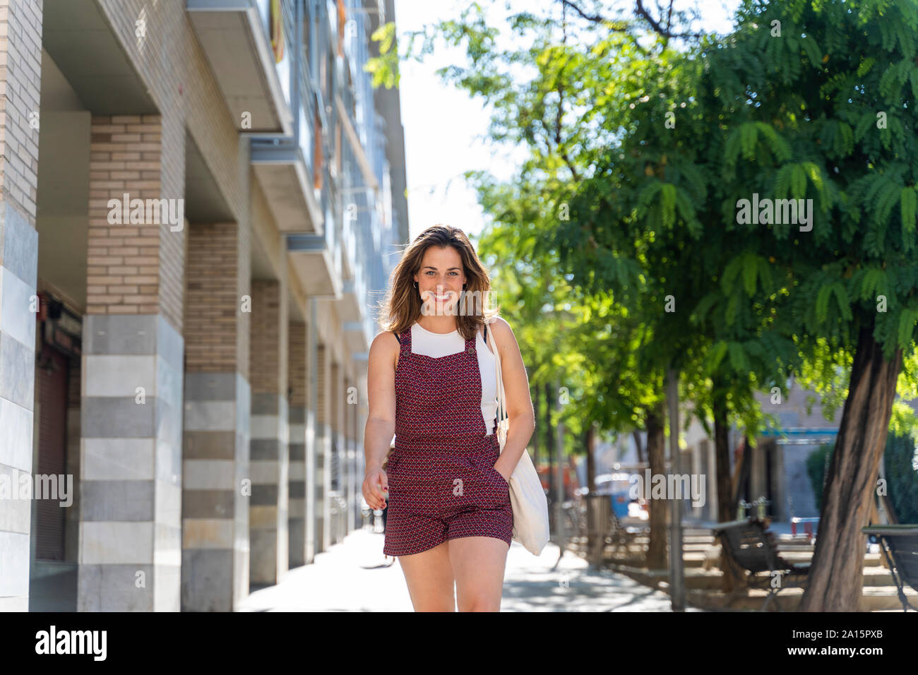Young woman walking in hi-res stock photography and images - Alamy