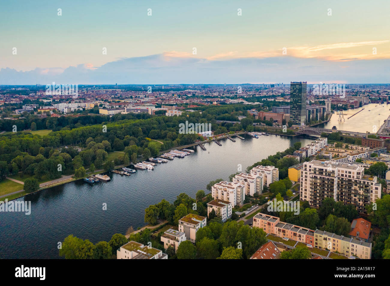 View of Berlin Treptower Park With City Skyline against sky during sunset Stock Photo