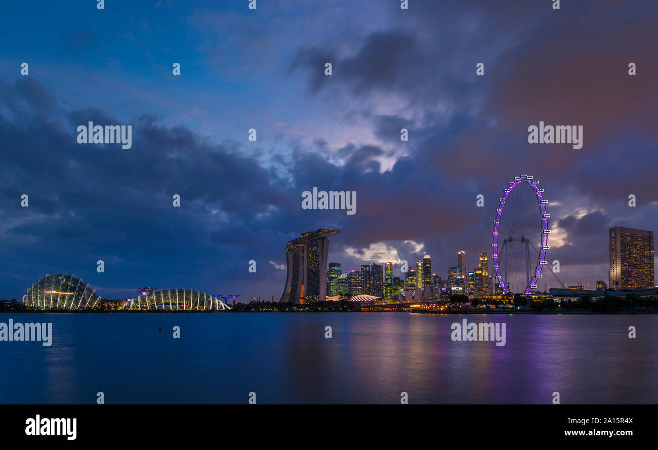 Gardens by the Bay and skyline with Singapore Flyer, Singapore Stock Photo