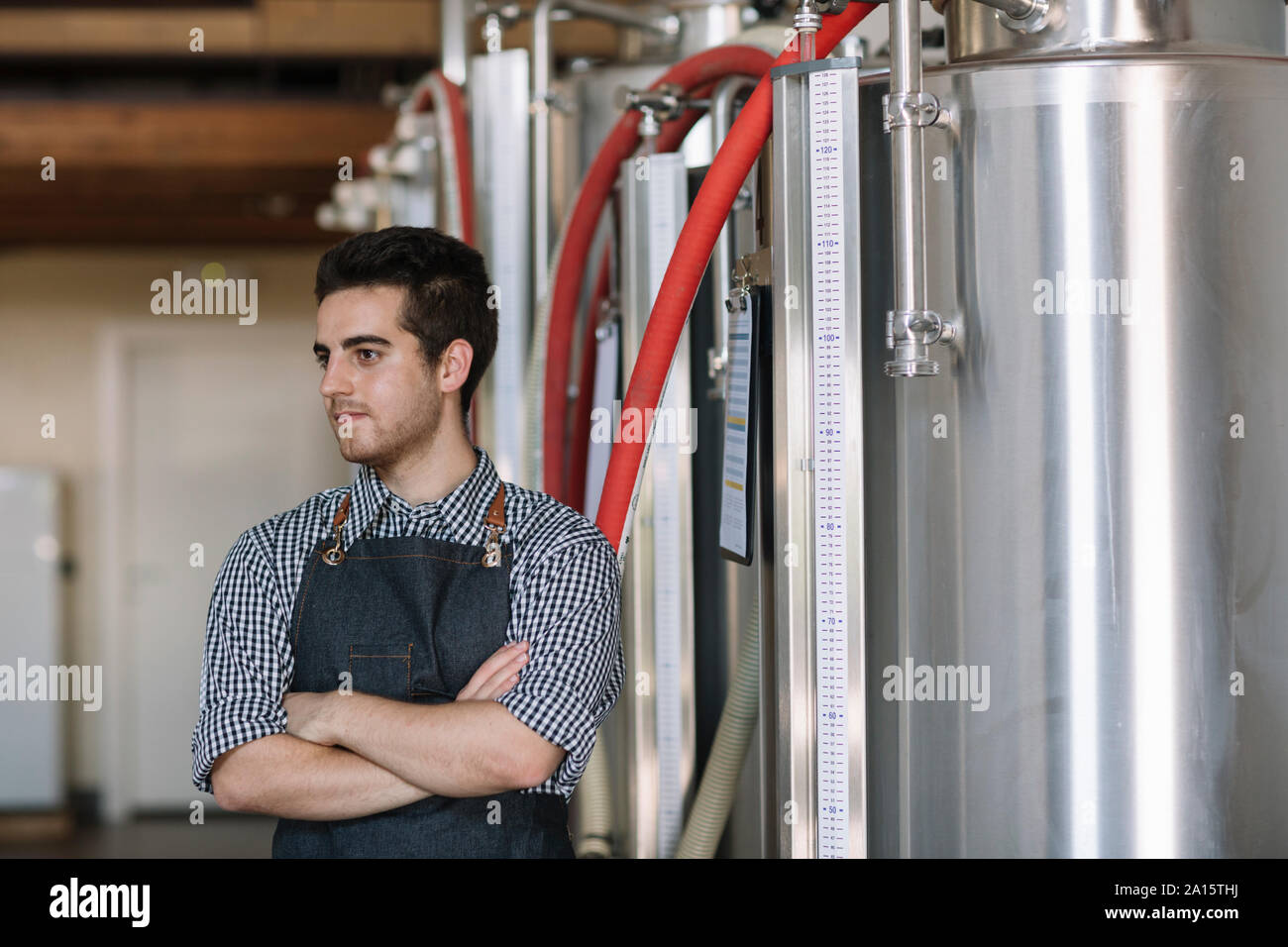 Portrait of young brewer at a brewery Stock Photo