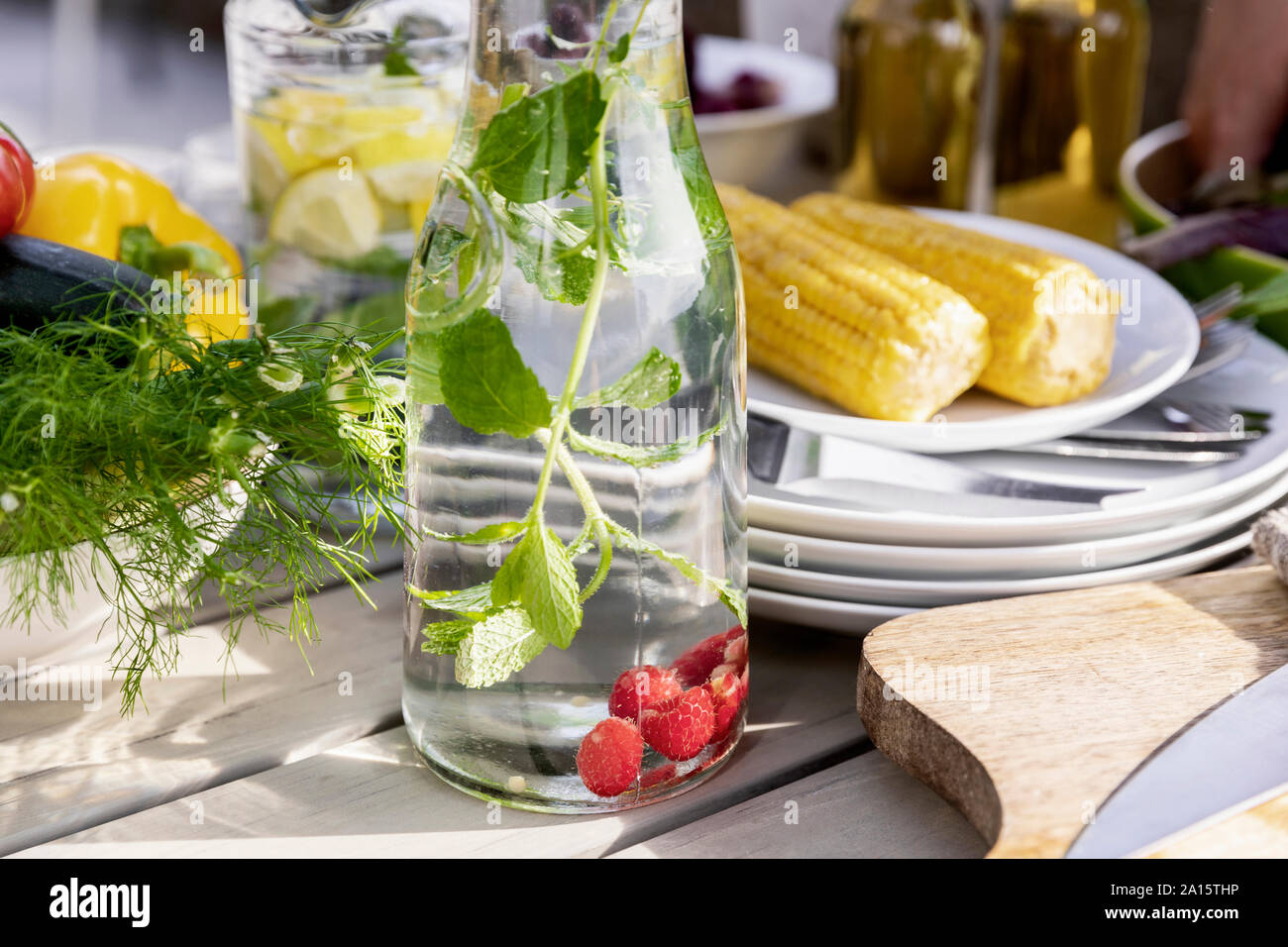 Detox infused water on garden table Stock Photo
