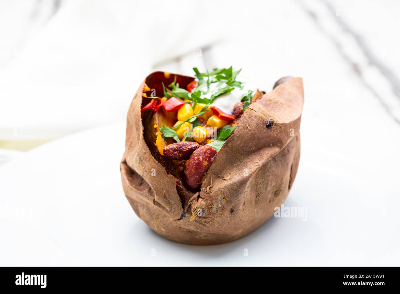 Sweet potato kumpir on plate Stock Photo