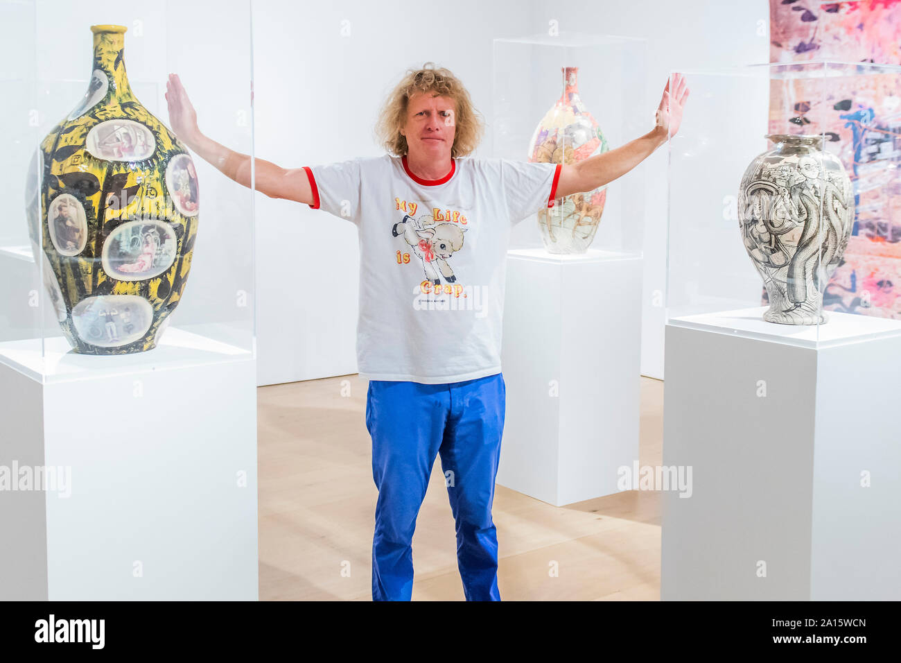 London, UK. 24th Sep 2019. Grayson Perry (pictured in a room full of his ceramics): Super Rich Interior Decoration a new exhibtion at Victoria Miro. The new work including pots, sculpture, large-scale prints, a tapestry and a carpet. For the first time, this work sees Perry working with material from the photographers Richard Young and Martin Parr and Eleni Parousi. Credit: Guy Bell/Alamy Live News Stock Photo