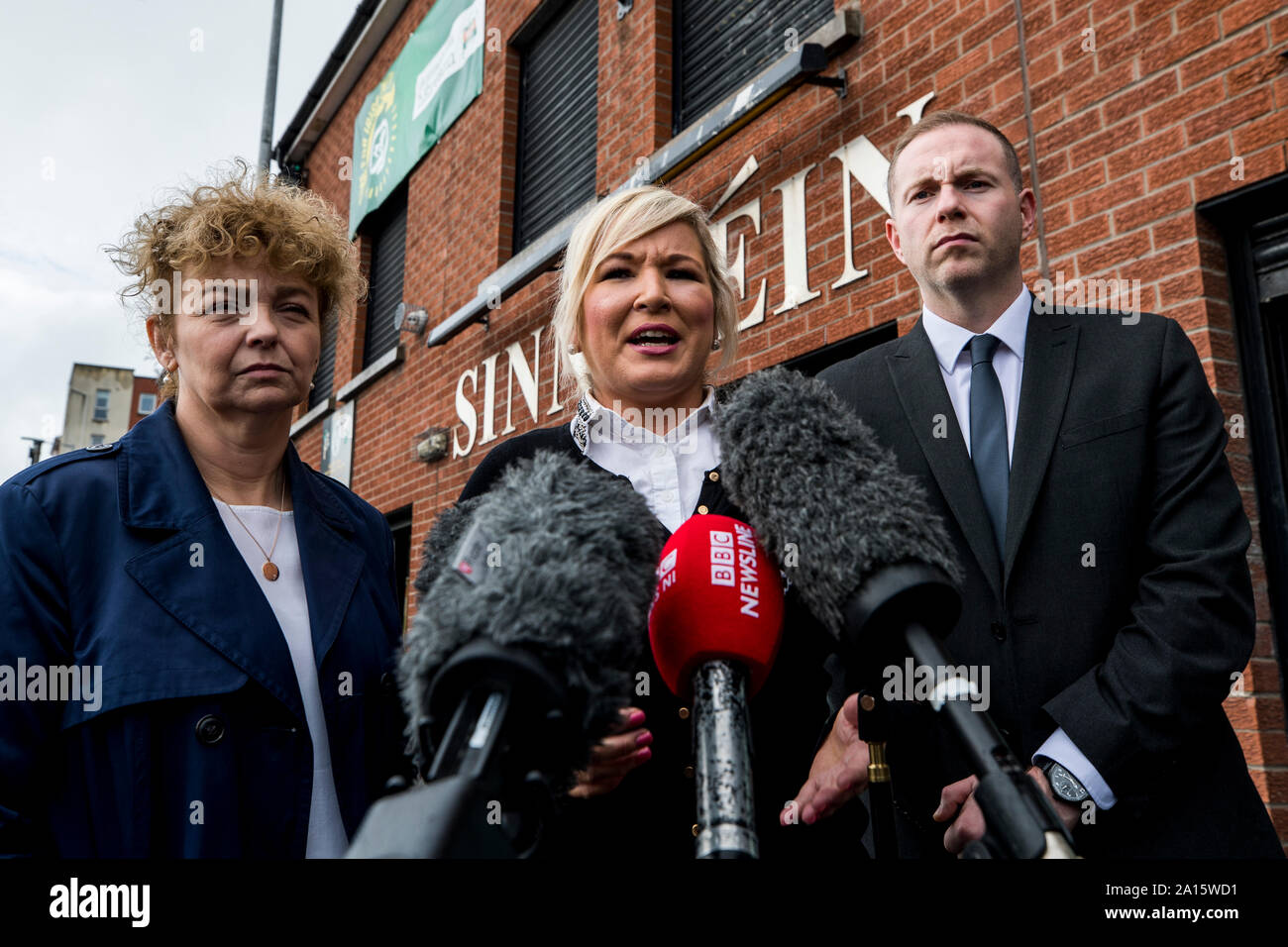 Sinn Fein Vice President Michelle O'Neill (centre) with party colleagues Caral Ni Chuilin (left) and Chris Hazzard (right) outside the party's headquarters in Belfast, as they react to the Supreme Court ruling that suspending Parliament was unlawful. Stock Photo