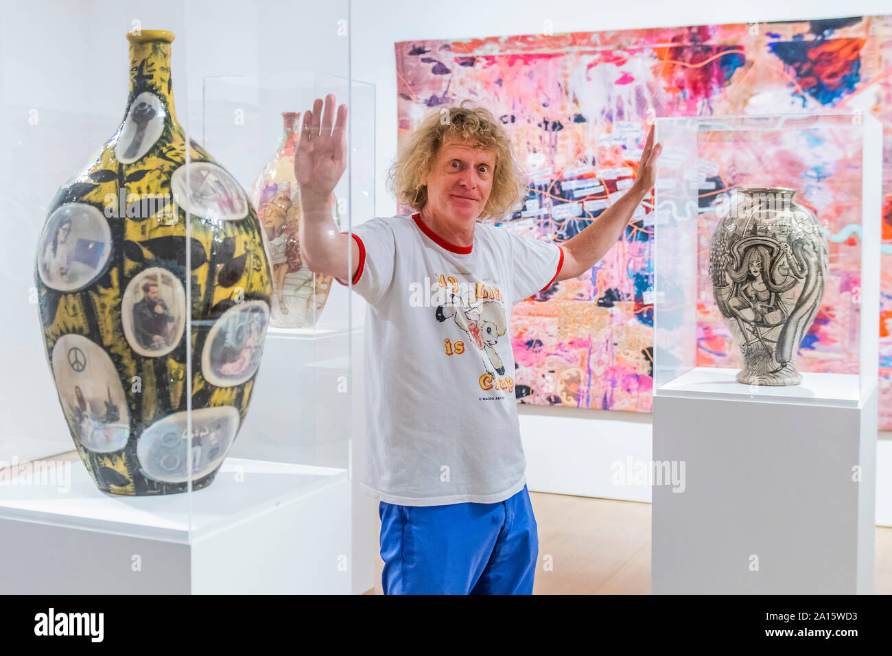 London, UK. 24th Sep 2019. Grayson Perry (pictured in a room full of his ceramics): Super Rich Interior Decoration a new exhibtion at Victoria Miro. The new work including pots, sculpture, large-scale prints, a tapestry and a carpet. For the first time, this work sees Perry working with material from the photographers Richard Young and Martin Parr and Eleni Parousi. Credit: Guy Bell/Alamy Live News Stock Photo