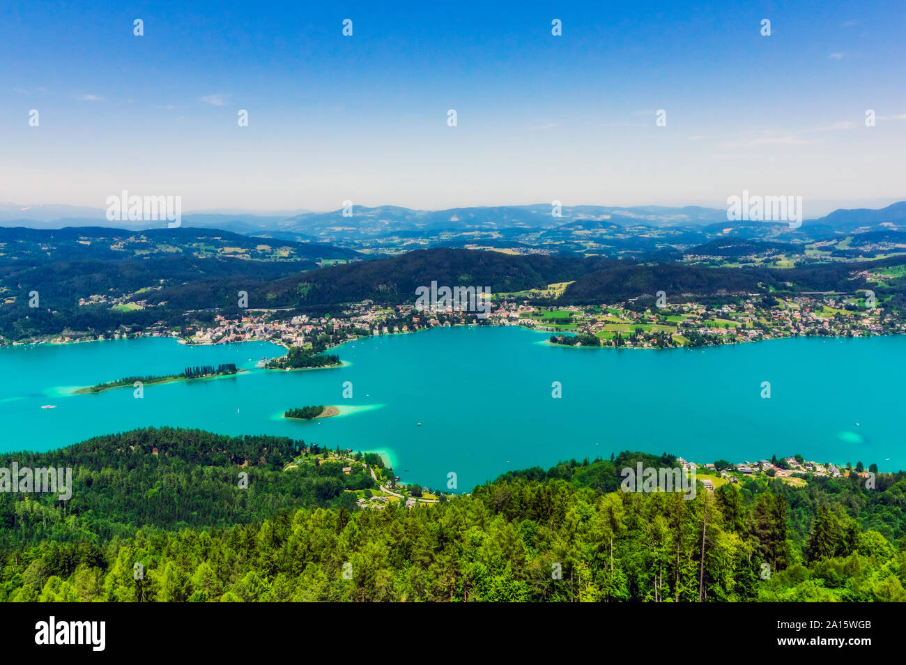 Scenic view of islands in Lake Worthersee from Pyramidenkogel tower against sky Stock Photo