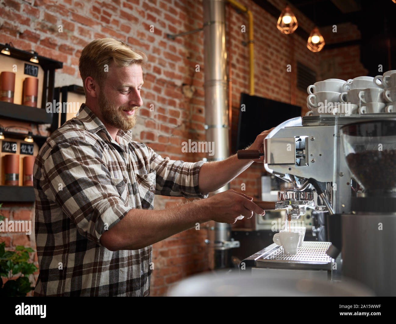 Man preparing espresso in a cafe Stock Photo