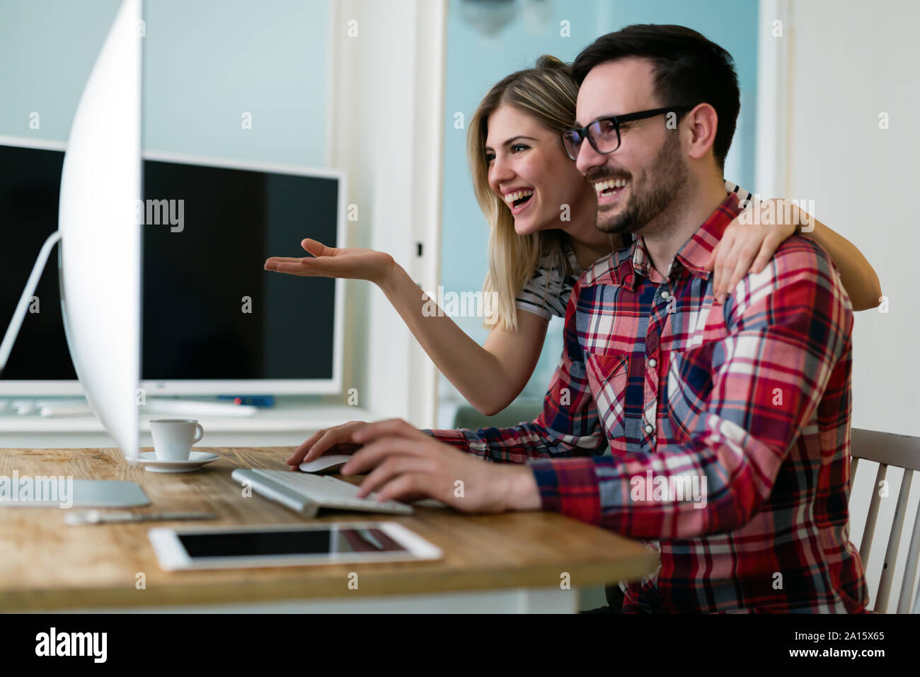 Young attractive designers working together from home Stock Photo