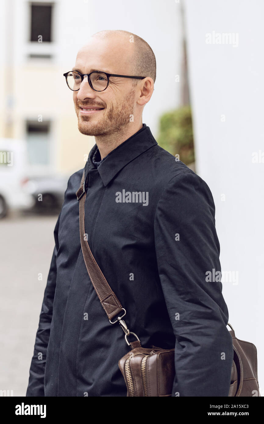 Smiling man on his way to work Stock Photo