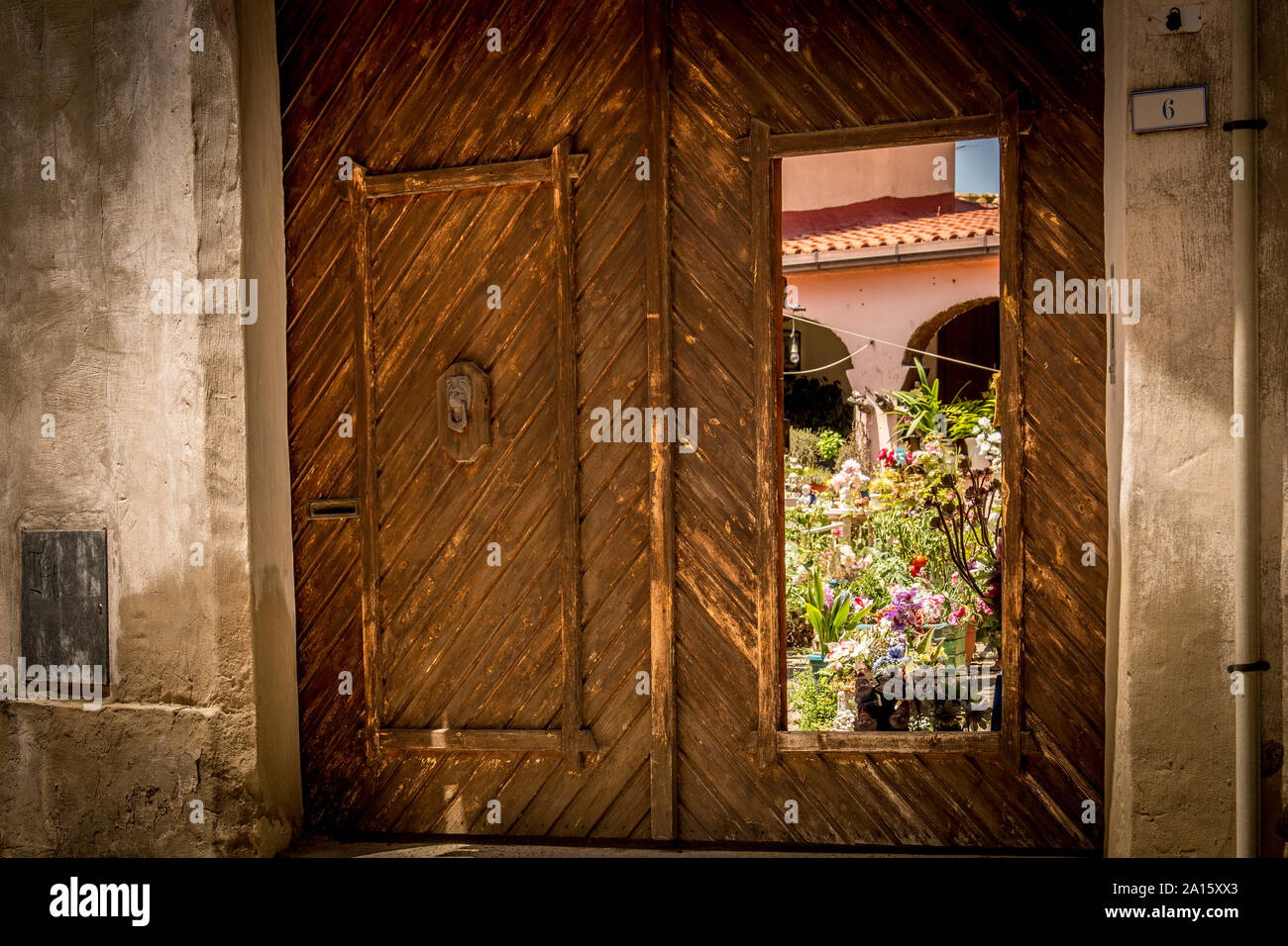 Open door to secret garden Stock Photo
