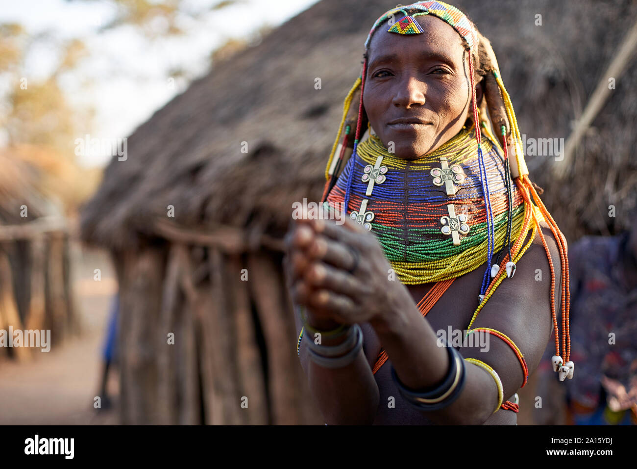 Muhila woman with her characteristic hairstyle and necklaces, Kehamba, Chibia, Angola Stock Photo