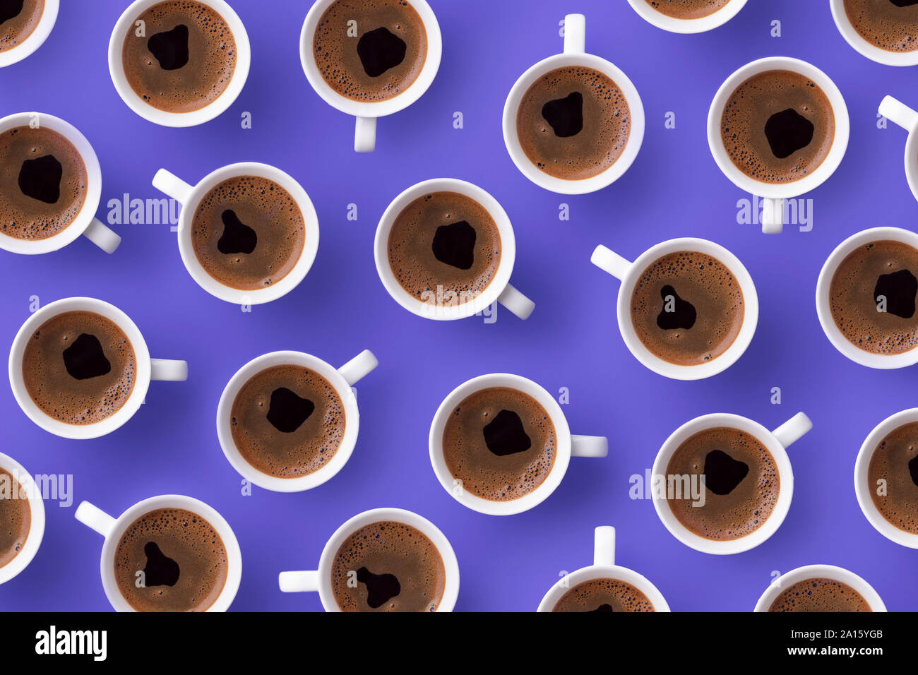 Directly above view of fresh coffee in cups over purple background Stock Photo