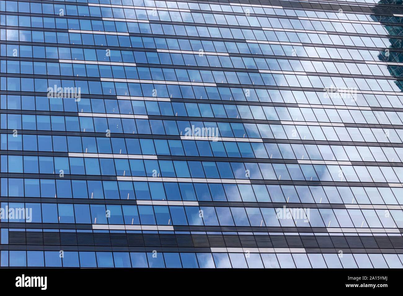 Windows of an office building with reflection of sky and clouds Stock ...