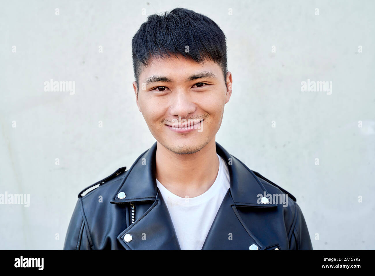 Portrait of confident young man wearing a leather jacket Stock Photo