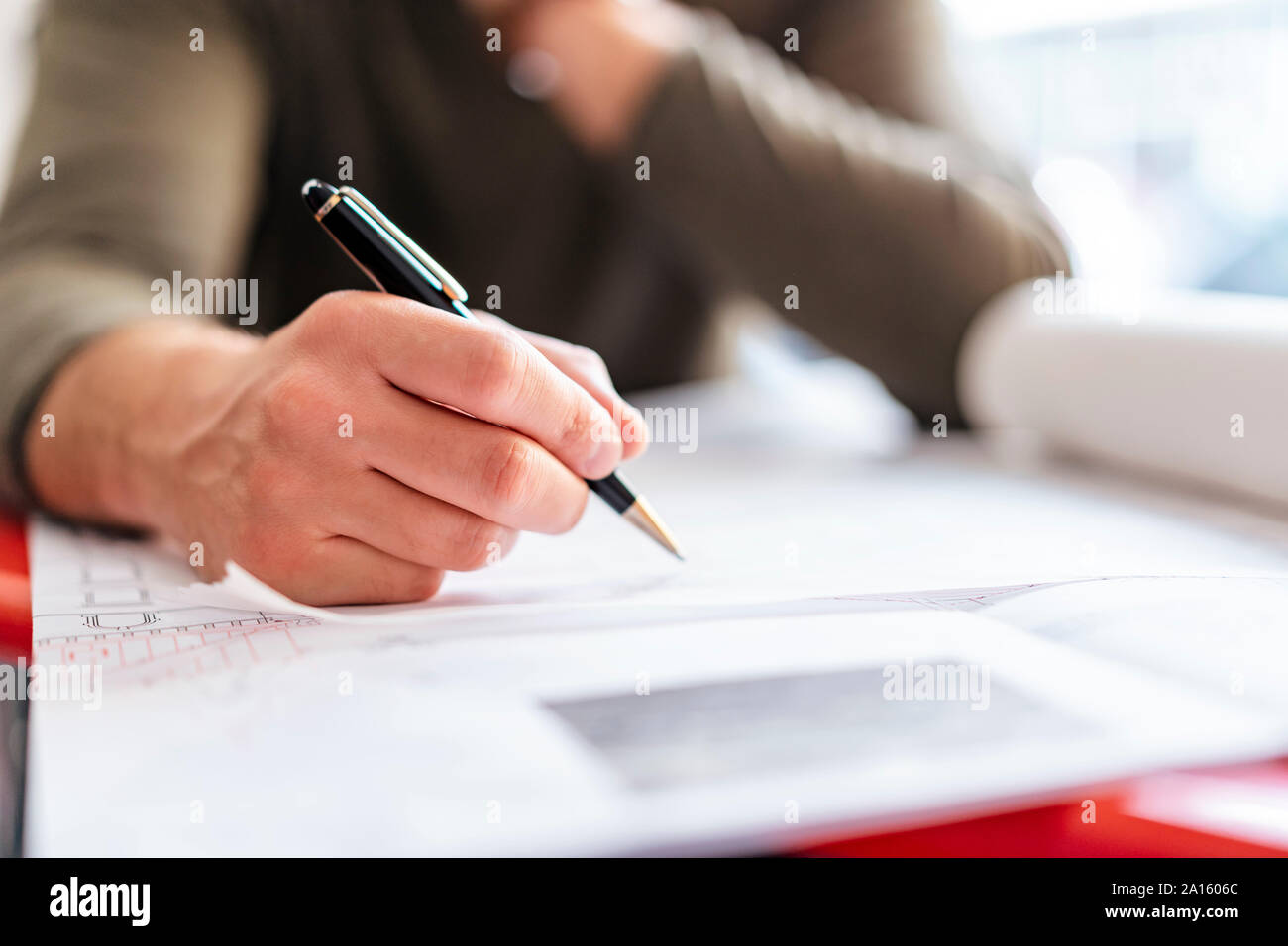 Close-up of architect working on plan in office Stock Photo