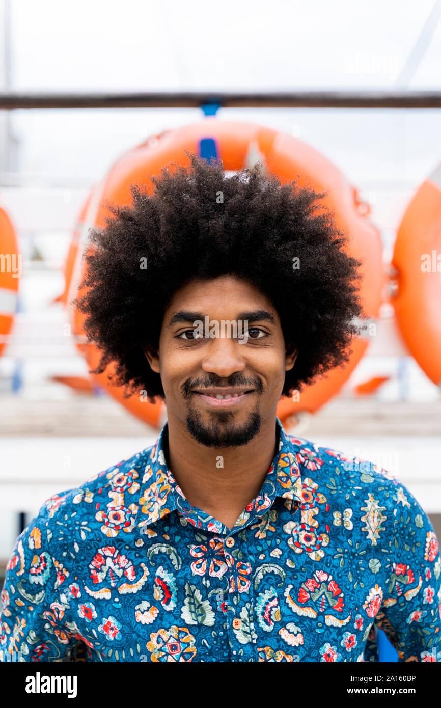 Portrait of smiling stylish man wearing funky shirt Stock Photo