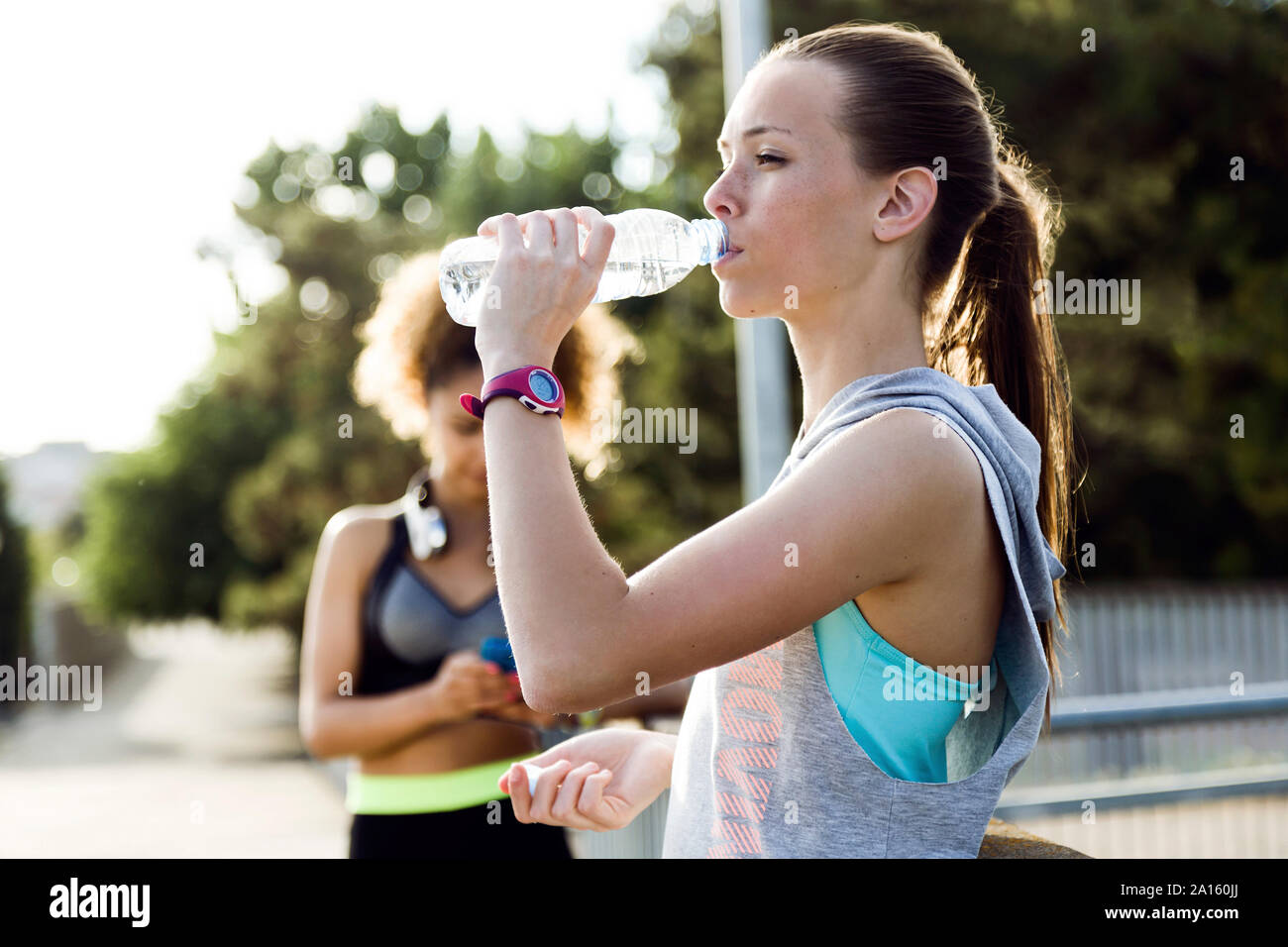 Two sporty young women finishing their workout Stock Photo