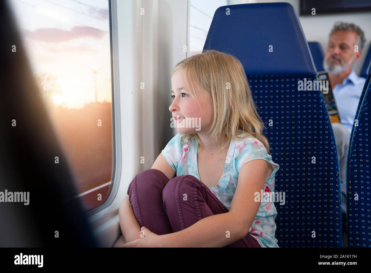 Little girl traveling by train Stock Photo