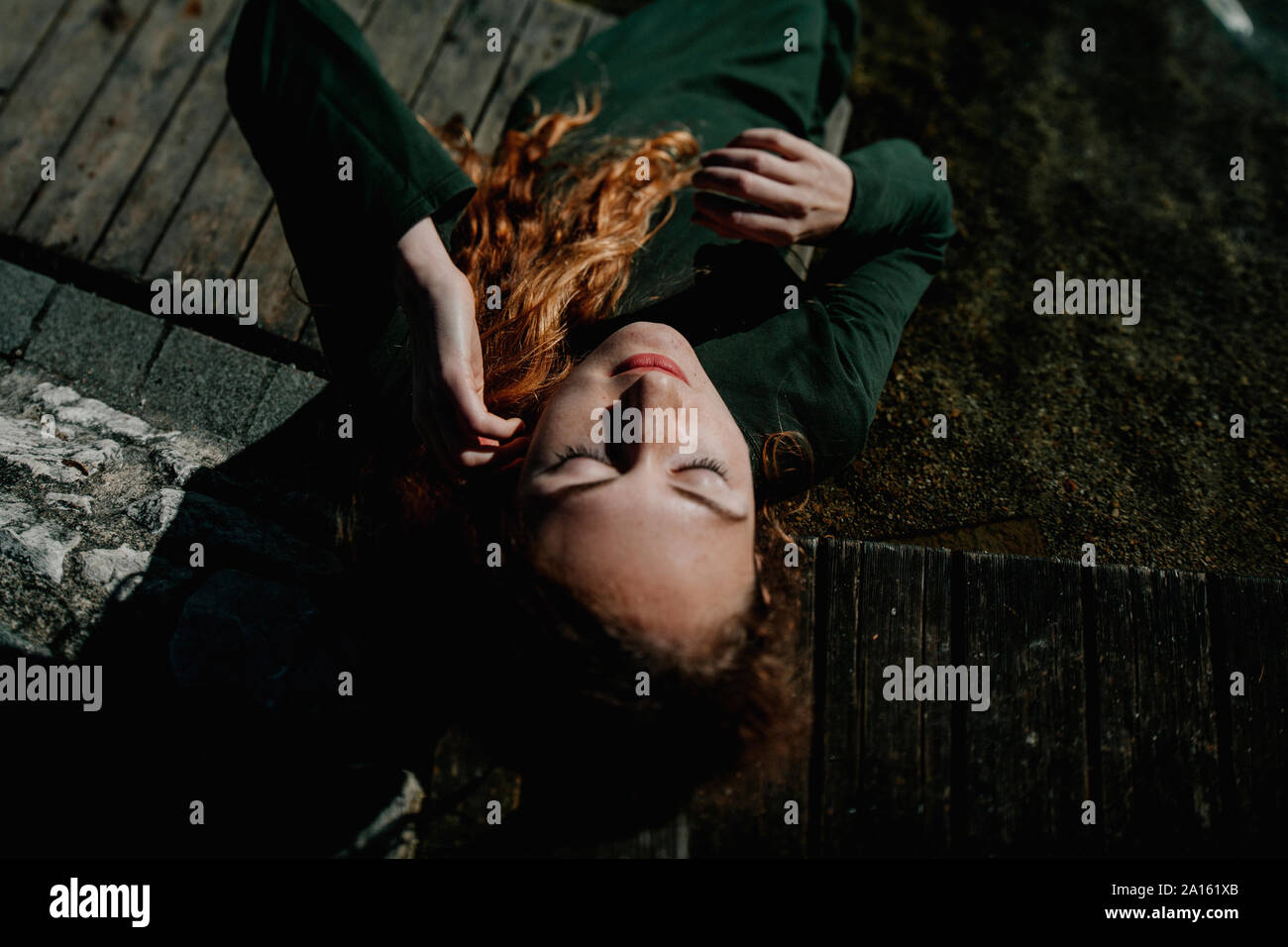 Portrait of redheaded woman lying Stock Photo