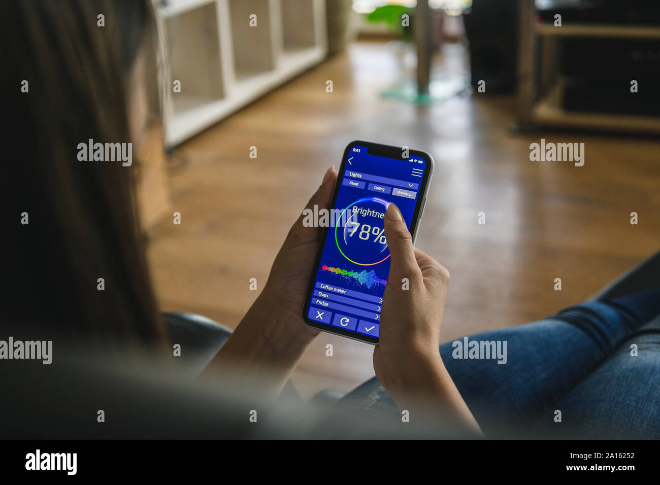 Adjusting brightness smartphone hi-res stock photography and images - Alamy
