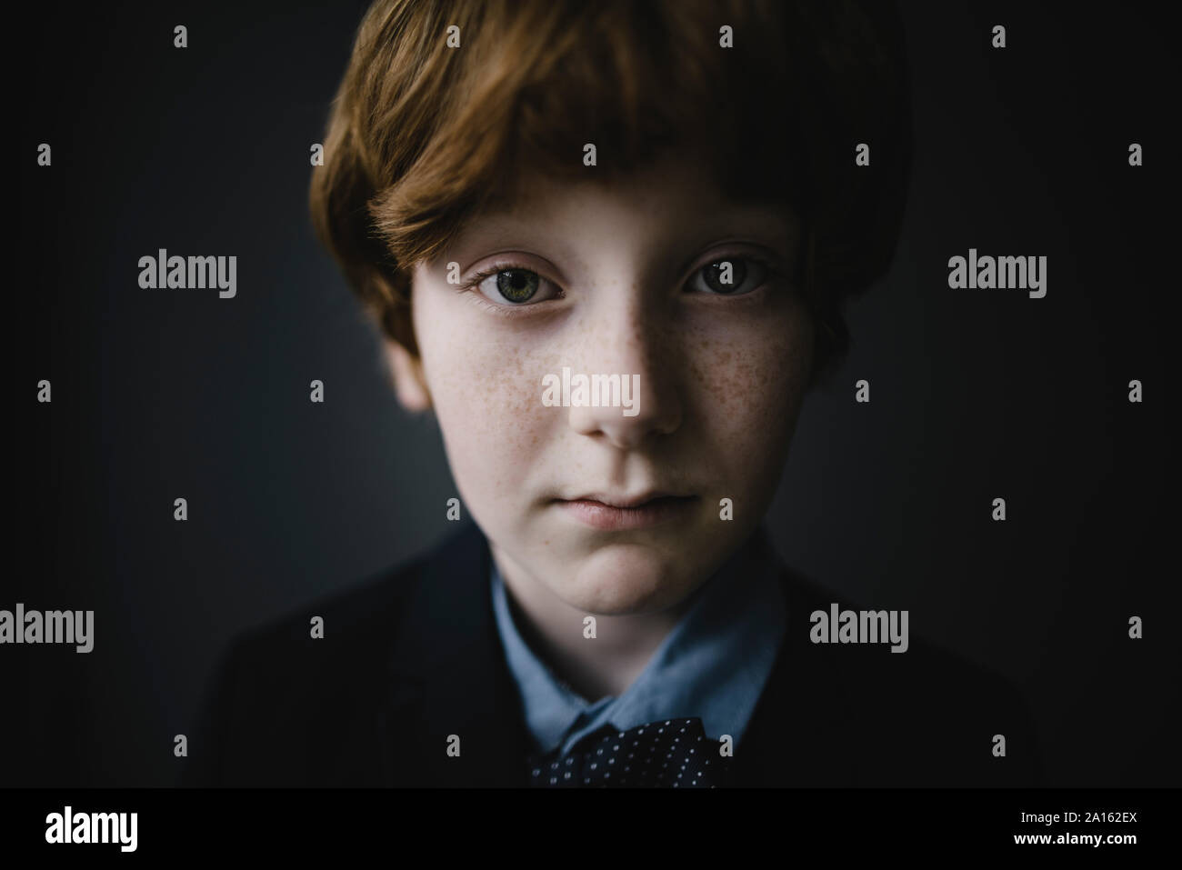 Portrait of sad boy with freckles Stock Photo