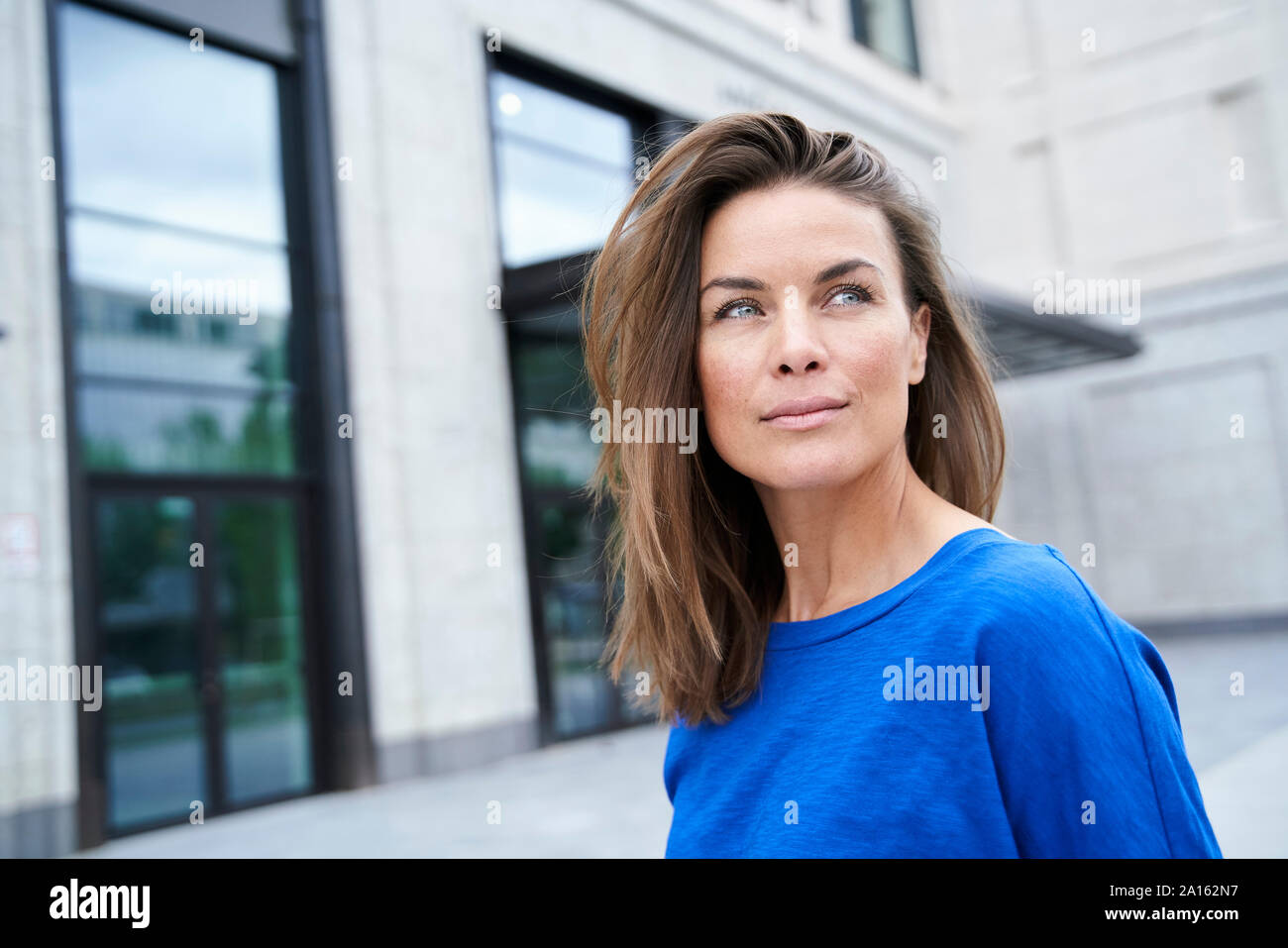 Woman in blue top hi-res stock photography and images - Alamy