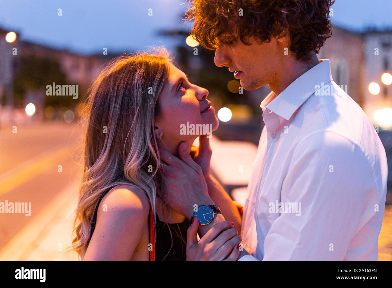 Young couple in love in the city at night Stock Photo